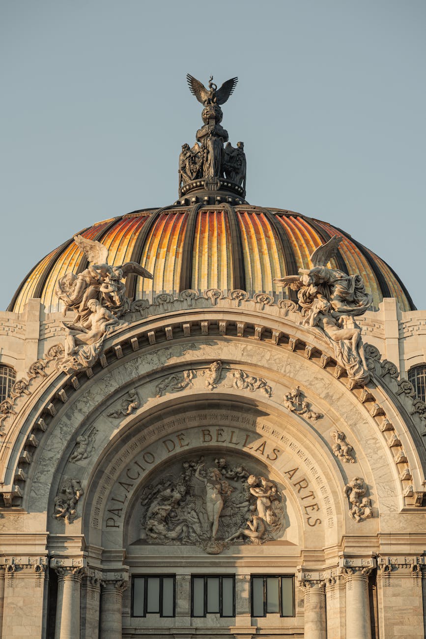 Close-up of the ornate dome of Palacio de Bellas Artes in Mexico City, showcasing architectural detail.