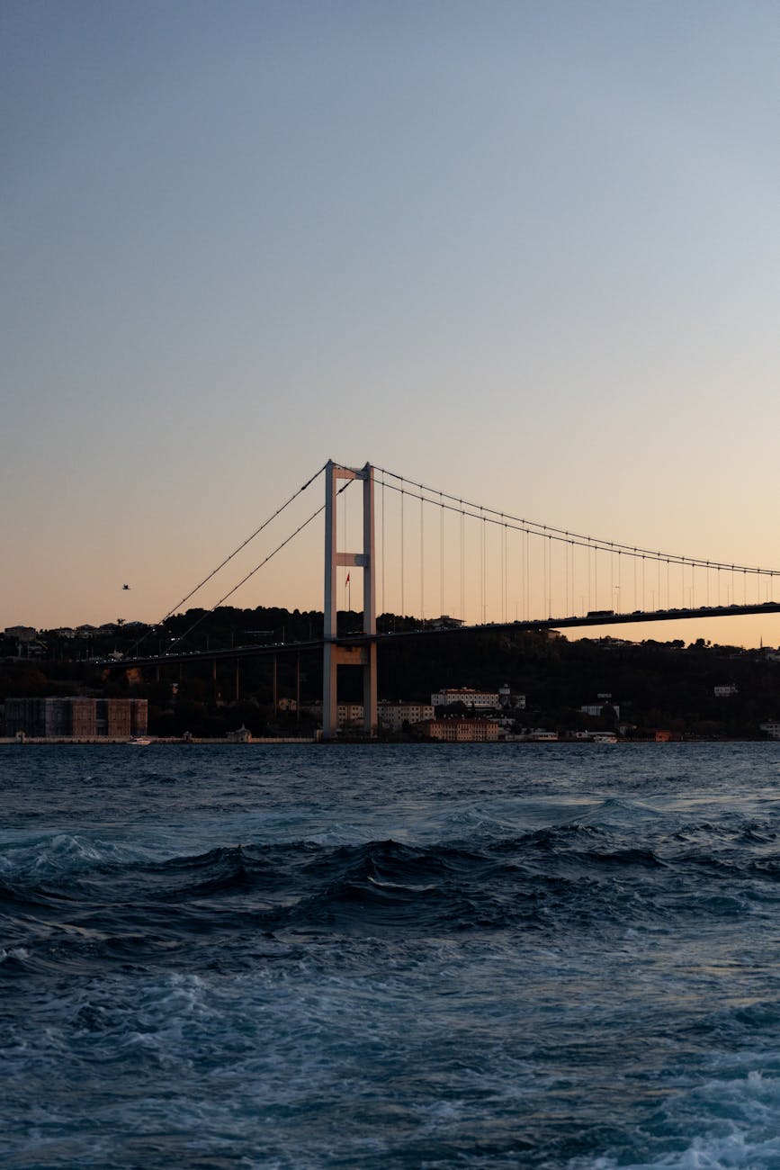 Scenic shot of Bosphorus Bridge at dusk with view over the Bosphorus Strait.