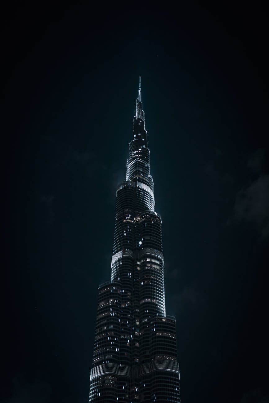 Dramatic nighttime photo of the iconic Burj Khalifa in Dubai's night sky.